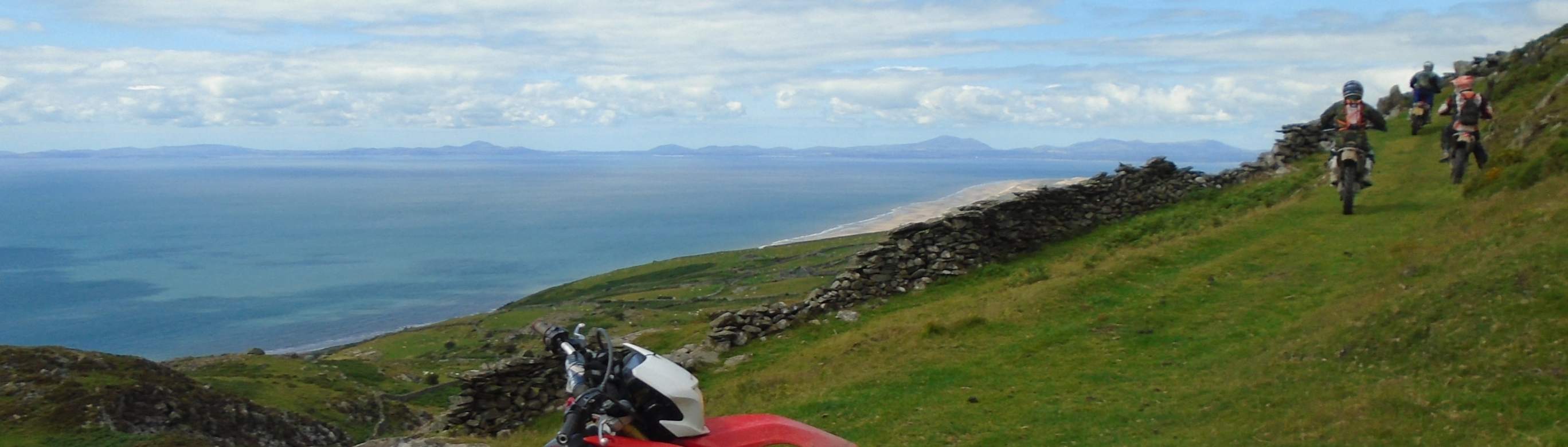 Trail riders with sea view and the Lleyn in the distance